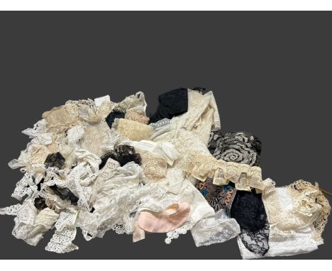 A quantity of antique and vintage lace trimmings, collars and veils to include a tambour lace bonnet veil, a brussels lace an
