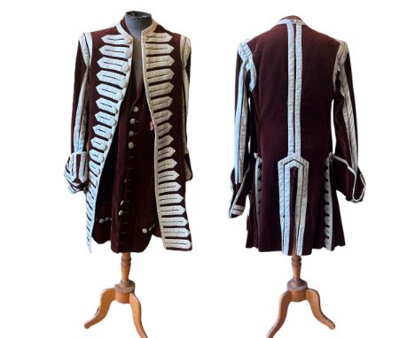 A group of antique and vintage theatrical clothing to include a velvet frock coat in the 18th century style with wool waistco