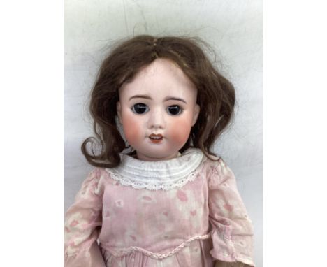   Antique French SFBJ 20” bisque head doll. Mold no 60 Parisian doll  with open close eyes, dark brown glass eyes, , much pai