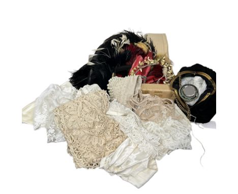 A group of vintage and antique accessories and millinery feathers to include a 1930s hand bag with paste set compact lid with