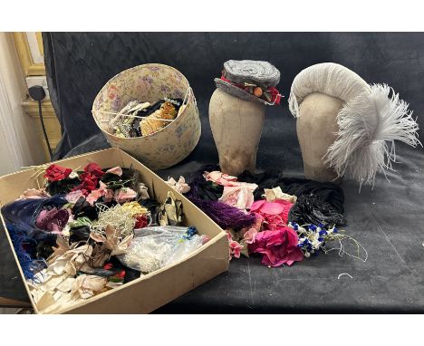 A collection of millinery feathers and flowers including edwardian birds of paradise with beaks, brightly coloured ostrich fe