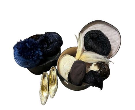 A collection of vintage headwear to include a 1930s black velvet hat with red felt flower detail two navy blue feather hats, 