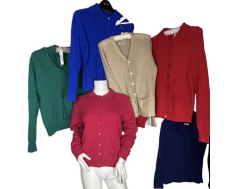 A group of 1950s and 60s jumpers and cardigans in different colours to include a fuchsia cardigan with Shetland wool label, a