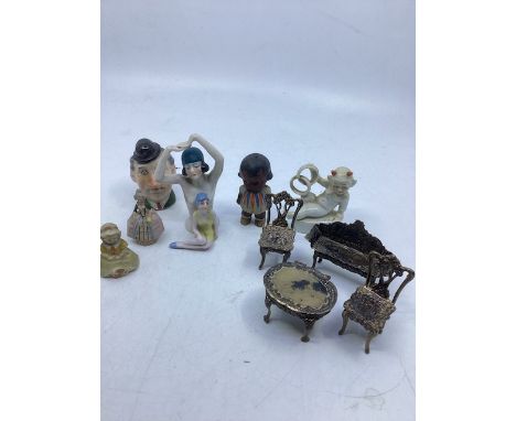 Antique silver Hallmarked dolls house furniture to include a table and a sofa and a pair of chairs and other small dolls and 