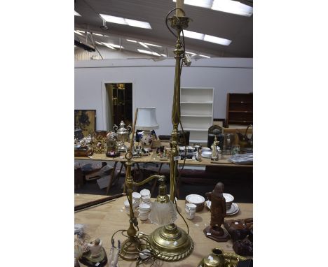 A cast brass adjustable table lamp/desk lamp The spreading circular base rising to a knopped stem with adjustable arm applied
