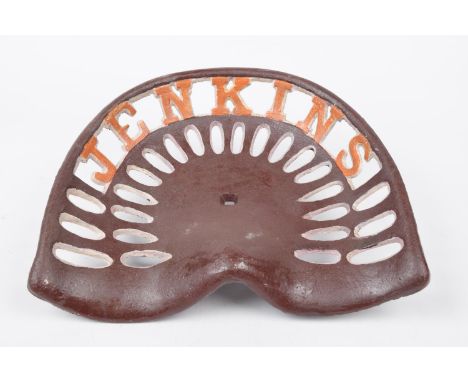 A vintage 'Jenkins' tractor seatThe cast metal seat with pierced panels and pierced text 'Jenkins' later painted, 38x31cm. 