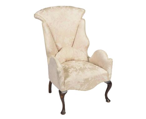 A rare and attractive mid 18th Century wing back fireside armchair, possibly Irish The fan shaped padded back flanked by serp