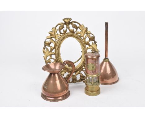 A mixed collection of metal waresA small half pint copper measure, a small brass and copper paraffin miners lamp, a copper fu