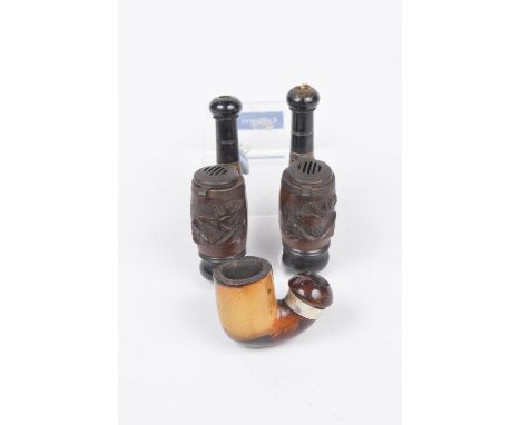 A collection of vintage pipesTo include two Bruyere Germany carved Black Forest style pipes and further stained wooden pipe (
