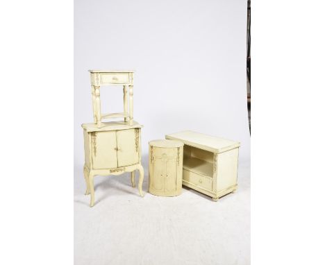 Four items of painted French style rustic furnitureTo include a two door serpentine cupboard, an oval bedside cabinet, a lamp