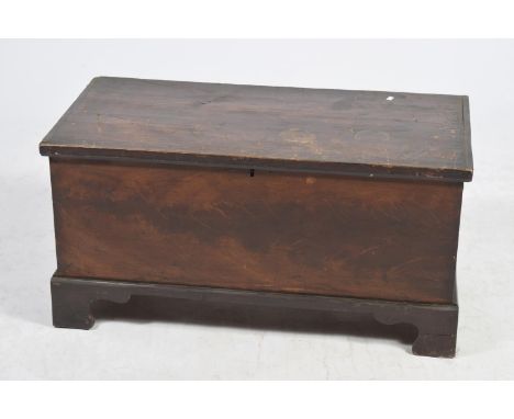 A Victorian stained pine blanket chestWith an enclosed candle box, raised upon bracket feet, 93x47x44cm. 