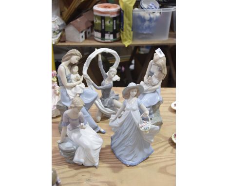 A collection of various Nao and Nadal figuresTo include a Nadal figure of a lady holding a basket of flowers, together with f