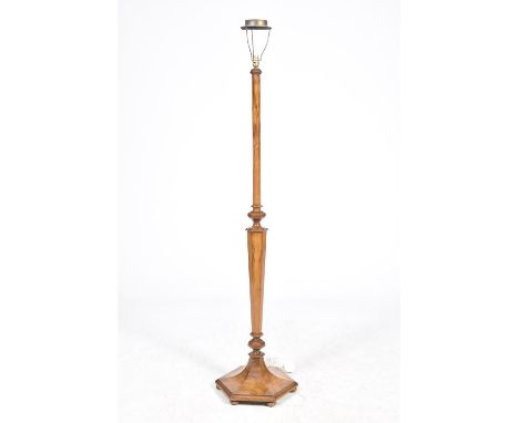 A 1920's Art Deco walnut lamp standardHaving a octagonal tapering shaft upon a octagonal plinth base, 154cm high. 