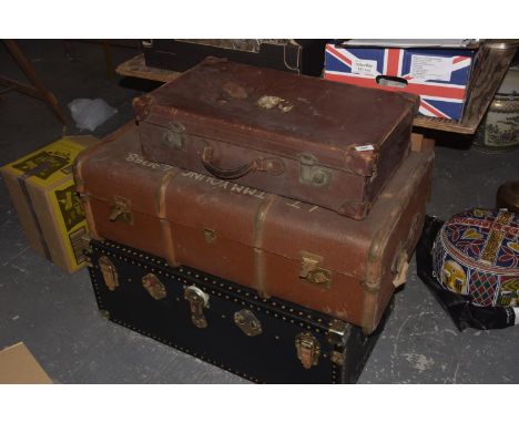 A collection of three vintage trunks and suitcases To include a studded black trunk with metal fittings, a wooden bound suitc