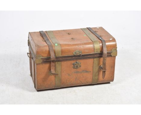 A vintage scumbled tin trunkWith simulated metal straps and fitted leather straps, applied with side swing handles, 72cm wide