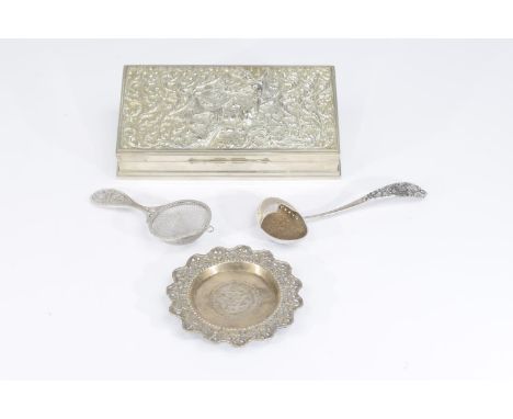 A collection of Indian and Chinese silver and white metal items To include an Indian white metal cigarette box, the cover det