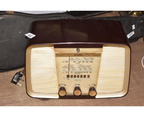 A vintage 1930's/40's Murphy Bakelite radioThe brown case with front grill and three turning knobs, 26x33cm. 
