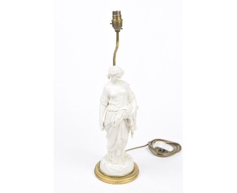 A Parian ware figural lamp baseThe gilt mounted circular base extending to a white matt glazed Parian figure of a maiden carr