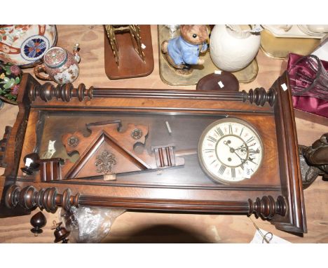 A late 19th Century mahogany Vienna wall clockThe architectural case with carved pillars to the glazed door revealing 7" whit