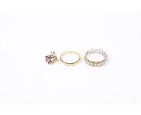 A selection of jewelleryTo include an 18ct gold band ring, a 9ct gold paste eternity ring, together with a diamond and ruby p