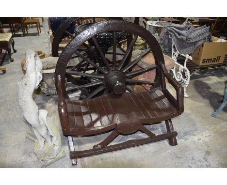 A painted hardwood garden bench constructed from a 19th Century cartwheelThe wheel back with a painted iron rim above the rus