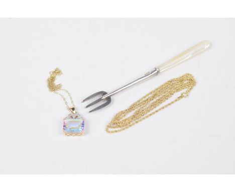 A selection of itemsTo include a 9ct gold mystic topaz and diamond pendant, a 9ct gold fancy link chain, and a silver pickle 
