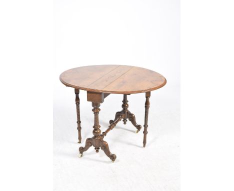 A Victorian burr walnut Sutherland tableThe quarter veneered oval dropleaf top supported on spirally incised uprights with a 