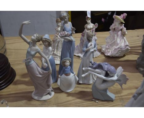 A collection of Nao figuresEach depicting a female figure in varying pose, smallest 16cm high and tallest 33cm high. 