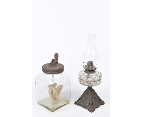 An early 20th Century butter churnA hand butter churn with wooden paddles within a glass churn.  Together with an early 20th 