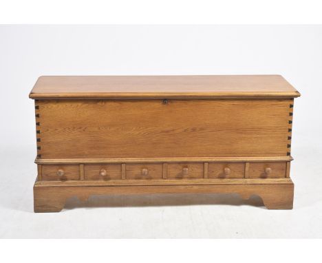A Lane "Virginia USA" cedar wood blanket chestHaving a rectangular hinged top above a plain front panel and six faux drawers,