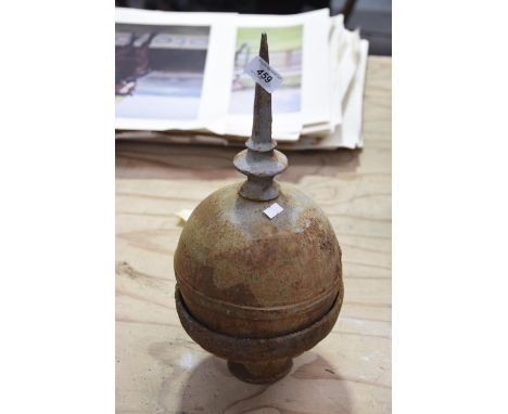 An architectural painted iron spherical finial Mounted within a circular plinth base, 43cm. 