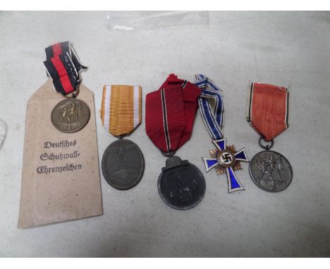 Third Reich medals:  German Defences medal, in printed paper packet, Eastern Front medal (oxidised surface), medals for 13th 