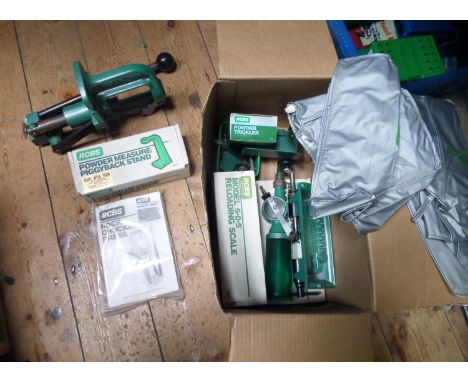 An RCBS "Rock Chucker Master Reloading Kit",  including reloading press, case trimmer, powder measure piggyback stand, powder