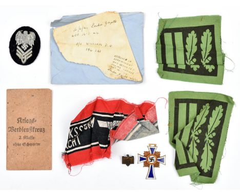 7 items of Third Reich insignia collected by Pilot Officer D.O. Williams c 1944, comprising a pair of printed green on black 