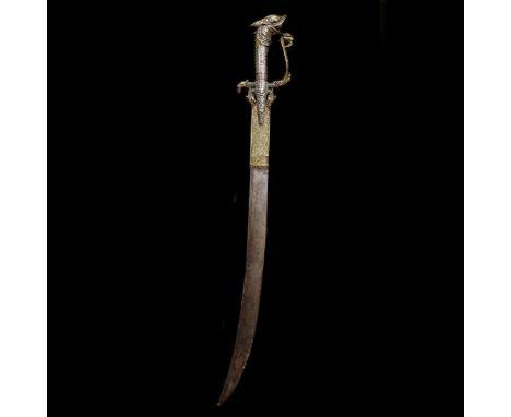 A Ceylonese sword kastane. 19th century, curved SE blade 36cms (cracked), brass hilt and forte covering of conventional form 