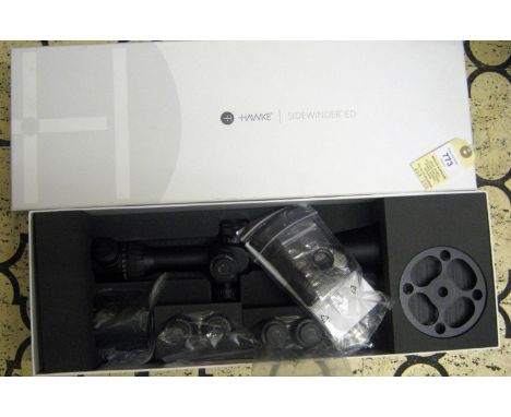 A good Hawke Sidewinder ED 10-50x60 Nitrogen charged telescopic sight, number 17370, in its original box with accessories, to
