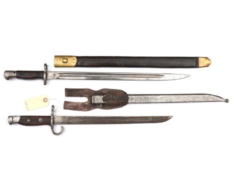 A P1907 sword bayonet,  cleaning hole in pommel, in a brass mounted scabbard, and a Japanese Arisaka bayonet, in scabbard wit