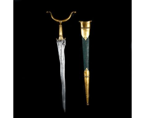 An unusual Indian fakir's crutch dagger. 19th century, wavy kris blade 38cms fluted at the top and with faint pamor, gilt cop