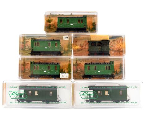 7 Egger-Bahn/Liliput 9mm/HOe items. A 4 wheel tram engine, RN102 in dark green livery. Together with 4x 4 wheel clerestory pa