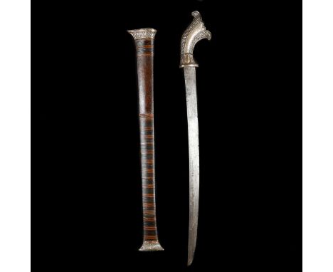 An Indonesian short sword parang. Second half of the 19th century, slightly curved SE pattern welded blade 52cms, swollen hil