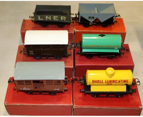 6 Hornby O Gauge Freight Wagons. An early open framed No.1 Wagon in LNER grey livery. A No.1 SR Cattle Truck. No.50 Hopper Wa