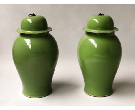 TEMPLE JARS, a pair, Chinese leaf green ceramic in the form of ginger jar with lids, 54cm H. (2)