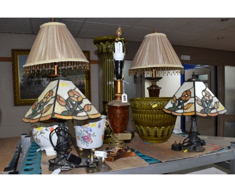 A GROUP OF LAMPS AND A JARDINIERE to include two Tiffany-style lamps with floral motifs (one with a cracked shade), a pair of