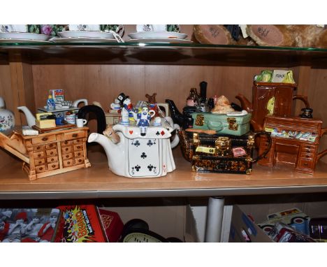 EIGHT NOVELTY TEAPOTS, comprising a South-West Ceramics Ltd Alice in Wonderland themed teapot (two shallow chips underneath l