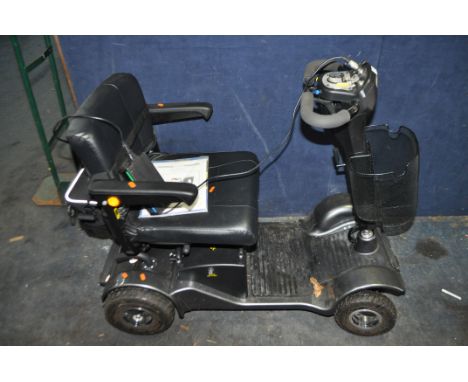 A STERLING SAPPHIRE 2 DISABILITY SCOOTER,  with charger, bag, manual and one key (PAT pass and working)