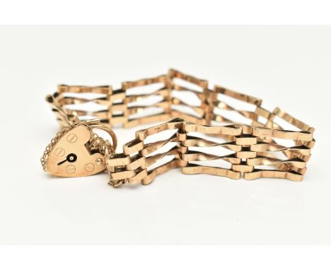 A 9CT GOLD GATE BRACELET, four bar bracelet, approximate width 13.0mm, fitted with a heart padlock clasp and additional safet