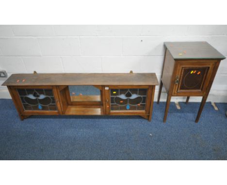 A 20TH CENTURY OAK WALL HANGING SHELF, with two lead glazed doors, flanking a bevelled edge mirror, width 152cm x depth 22cm 