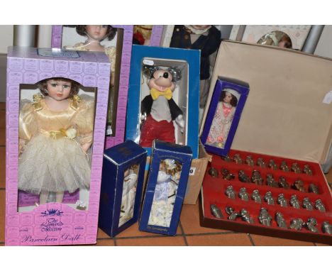 A BOX AND LOOSE CHESS PIECES AND COLLECTORS DOLLS, comprising an Ajedrez metal chess set in a fitted case, tallest piece appr