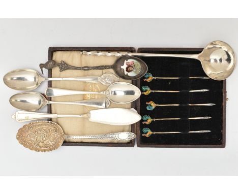 A SELECTION OF SILVER CUTLERY PIECES, to include a cased set of five silver toothpicks, each terminal set with an enamel deta