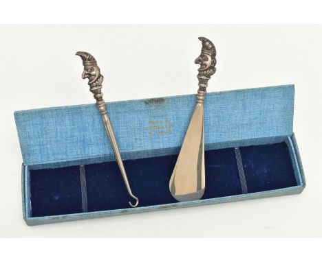 A SILVER HANDLED SHOE HORN AND BUTTON HOOK, each terminal depicting Punch, hallmarked 'Crisford &amp; Norris Ltd' Birmingham 